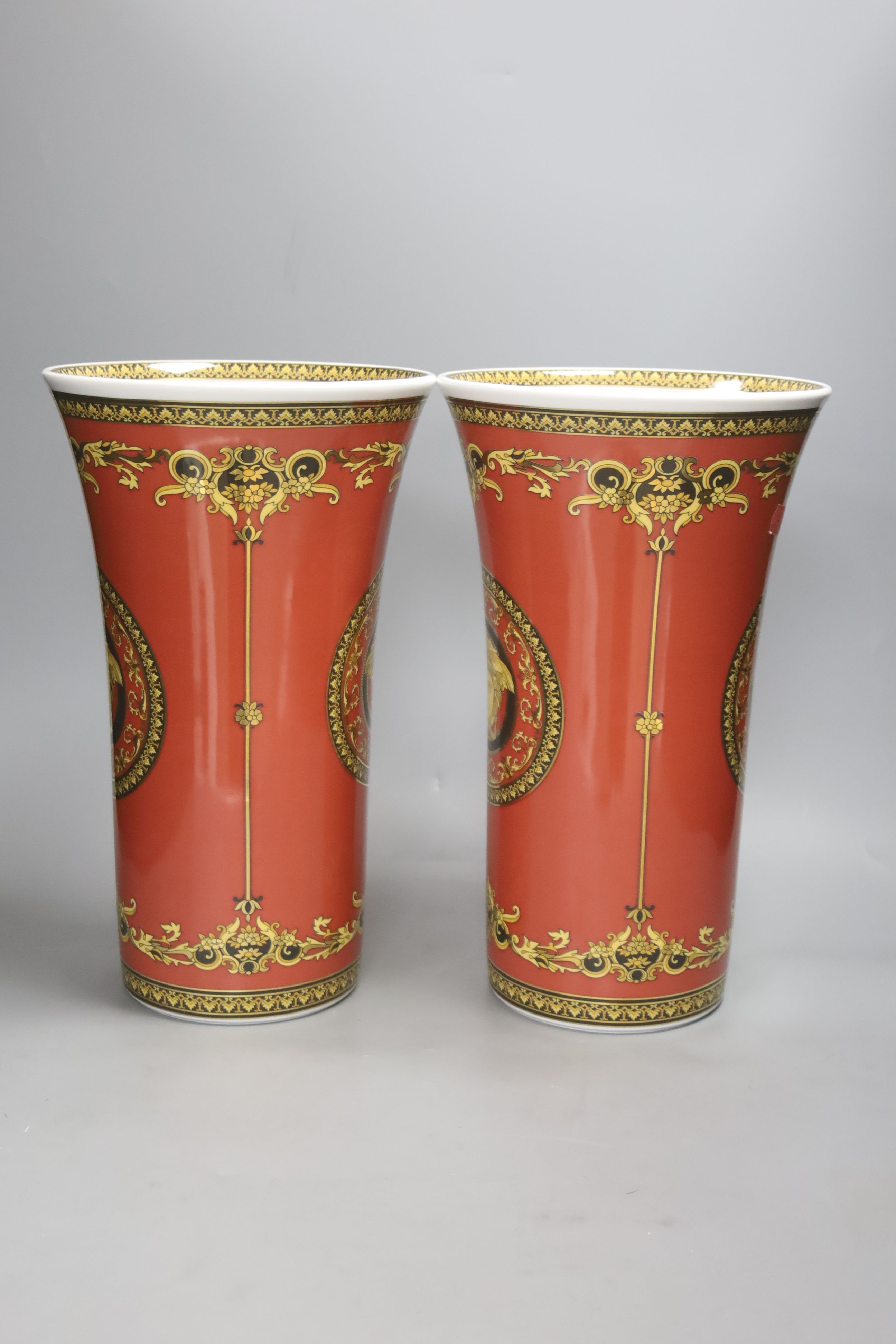 A pair of Rosenthal Versace 'Medusa Red' tapered vases, height 34cm H 34cm